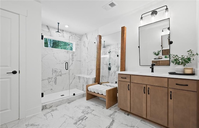 full bathroom with marble finish floor, visible vents, vanity, and a marble finish shower