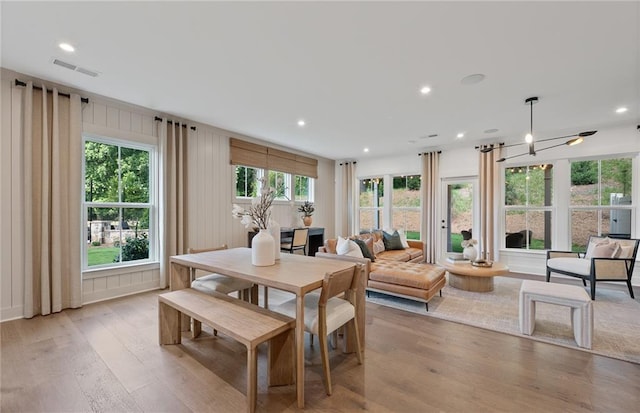 dining space featuring a chandelier, recessed lighting, visible vents, and light wood-style floors