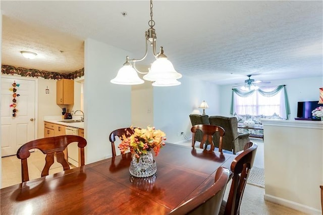 dining room featuring a textured ceiling and ceiling fan