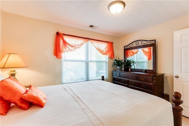 bedroom with visible vents