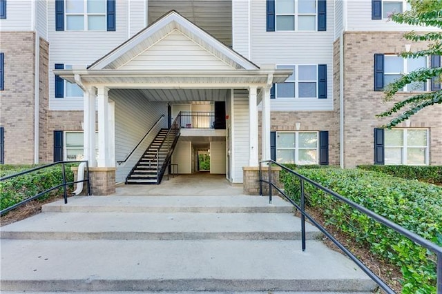 entrance to property with brick siding