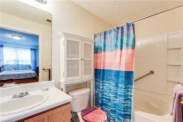 full bathroom featuring shower / bath combo, vanity, toilet, a textured ceiling, and ensuite bathroom