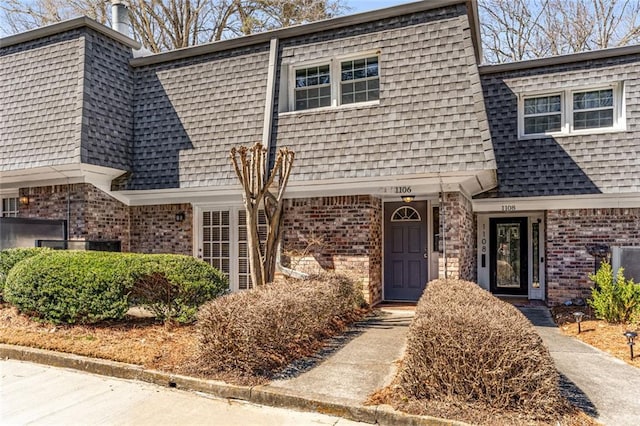 1106 Hampton Way NE, Atlanta, GA 30324 - view of front of home with mansard roof, brick siding, and a shingled roof