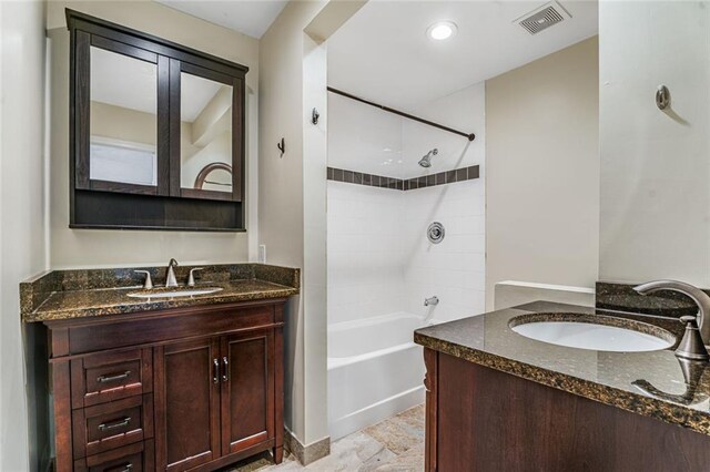 1106 Hampton Way NE, Atlanta, GA 30324 - bathroom featuring vanity, shower / washtub combination, and stone finish floors