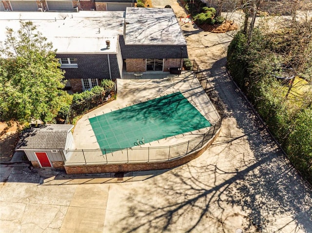 view of swimming pool with a patio area and fence