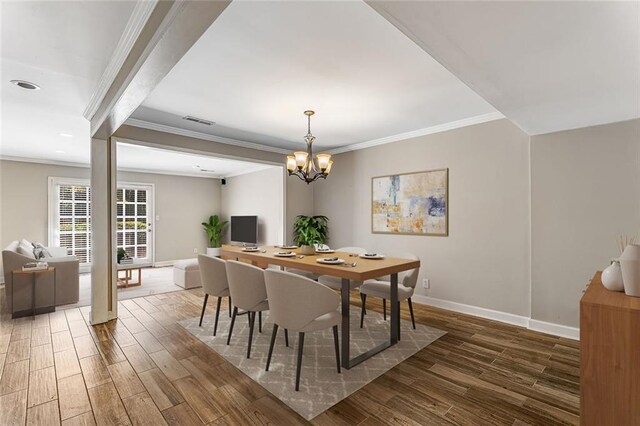 1106 Hampton Way NE, Atlanta, GA 30324 - dining area with ornamental molding, wood finished floors, baseboards, and a chandelier