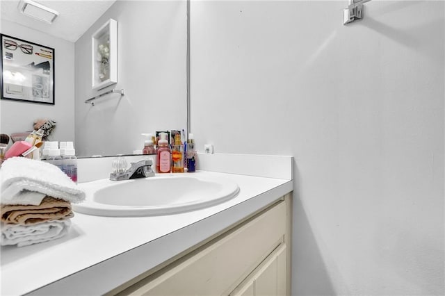 bathroom with visible vents and vanity