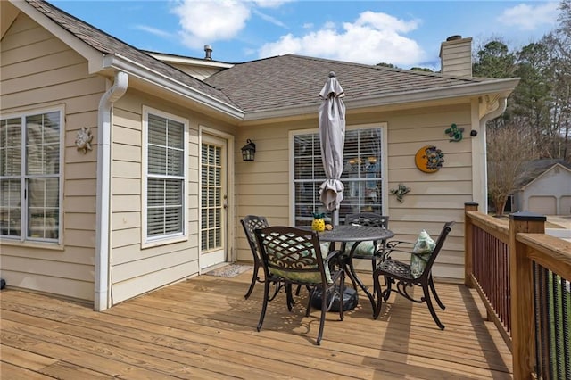 deck with outdoor dining area