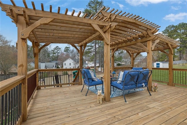 deck featuring an outbuilding, a storage shed, and a pergola