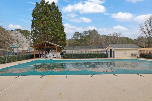 pool featuring a gazebo, a patio area, and fence