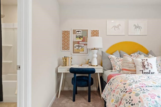 bedroom featuring light carpet