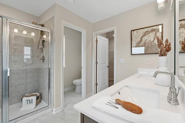 bathroom with vanity, toilet, and walk in shower