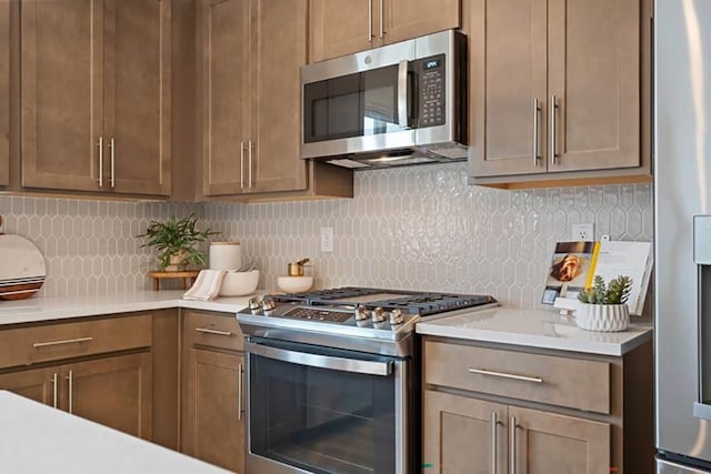 kitchen featuring decorative backsplash and stainless steel appliances