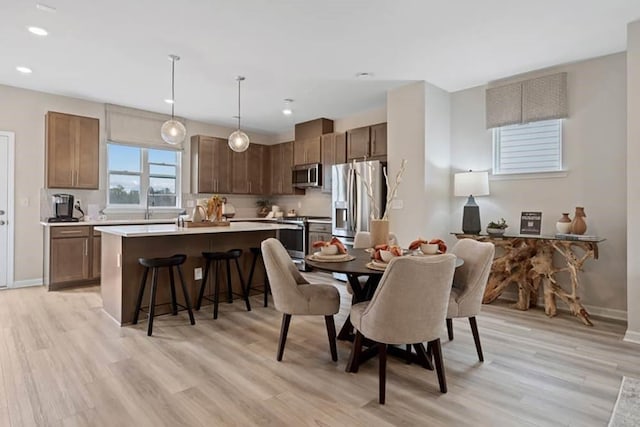 dining room with light wood-type flooring