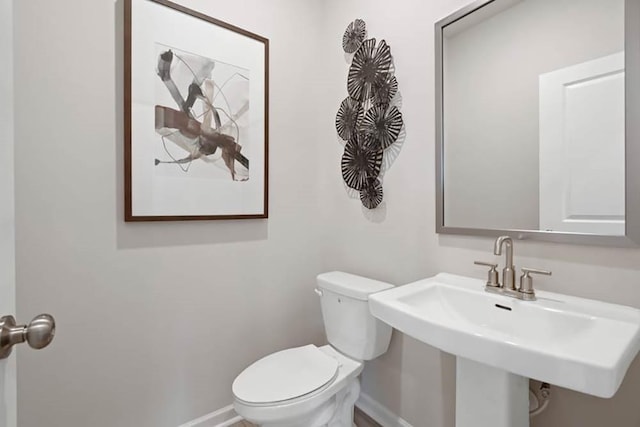 bathroom with sink and toilet