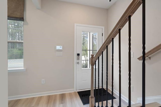 foyer entrance with light hardwood / wood-style flooring