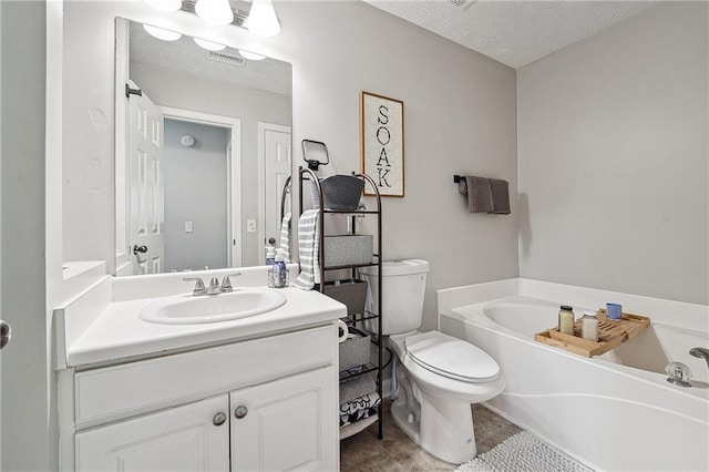 119 Ashley Way, Jefferson, GA 30549 - full bathroom featuring a bath, toilet, vanity, a textured ceiling, and tile patterned flooring
