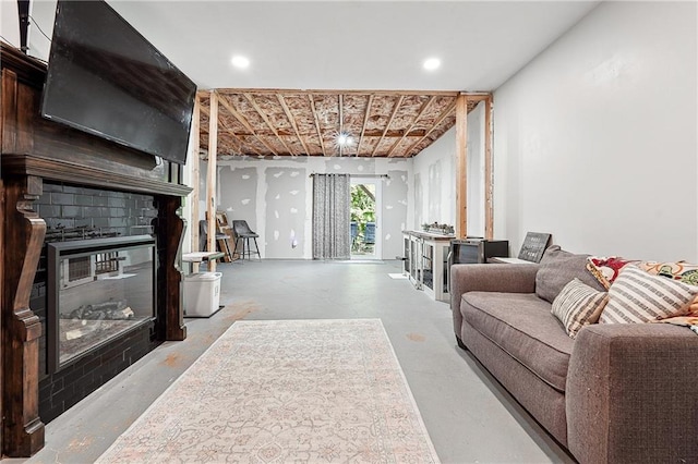 119 Ashley Way, Jefferson, GA 30549 - living area with a glass covered fireplace and concrete floors