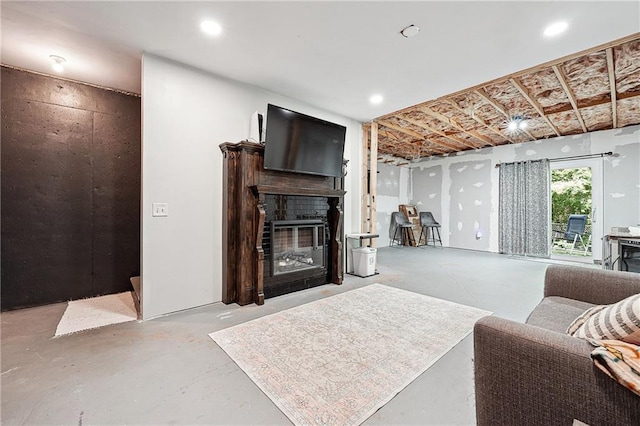 119 Ashley Way, Jefferson, GA 30549 - living room with a fireplace with flush hearth and finished concrete flooring