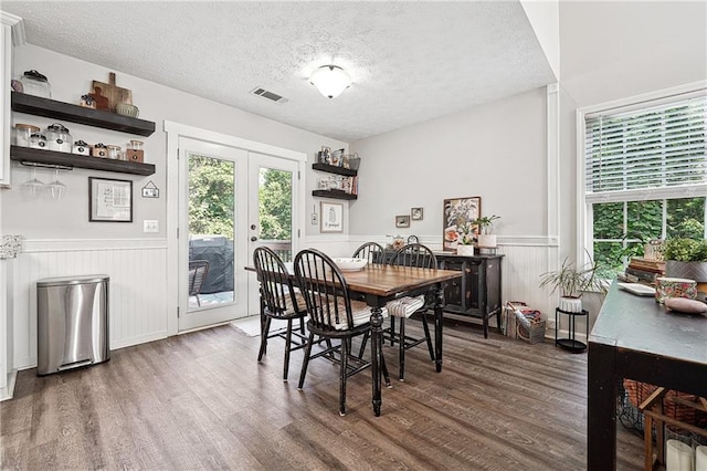 119 Ashley Way, Jefferson, GA 30549 - dining area featuring a wainscoted wall, wood finished floors, a textured ceiling, and french doors