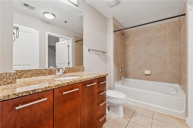 full bath featuring tile patterned floors, toilet,  shower combination, and vanity