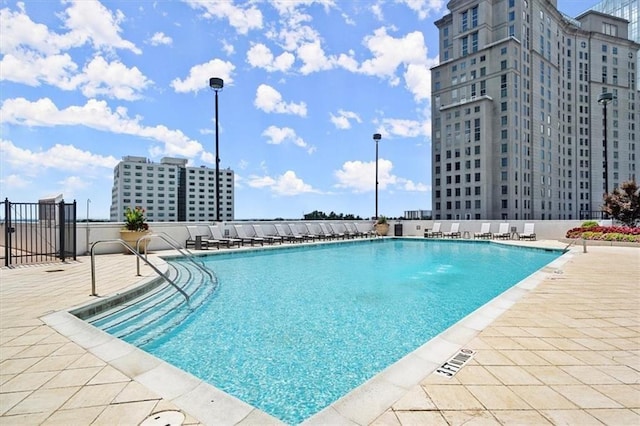 community pool with a patio