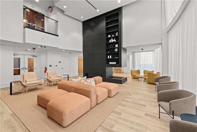 community lobby with a high ceiling and recessed lighting