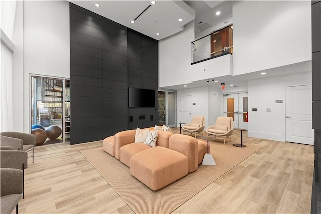 common area featuring a high ceiling and recessed lighting