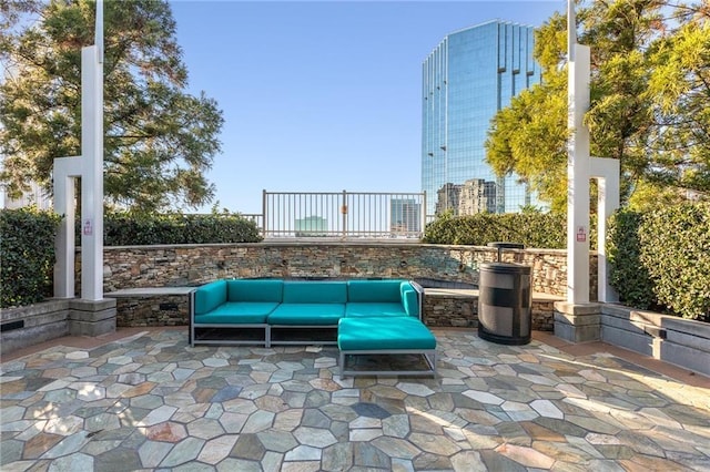 view of patio / terrace with an outdoor hangout area and a view of city