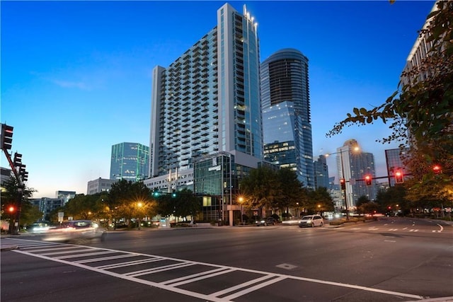 property at dusk with a view of skyline
