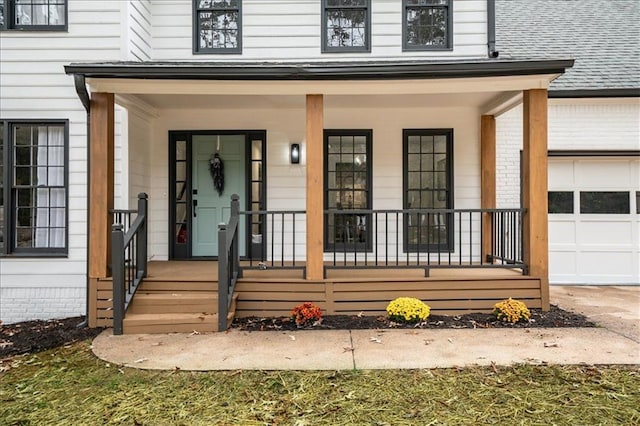 entrance to property with a porch and a garage