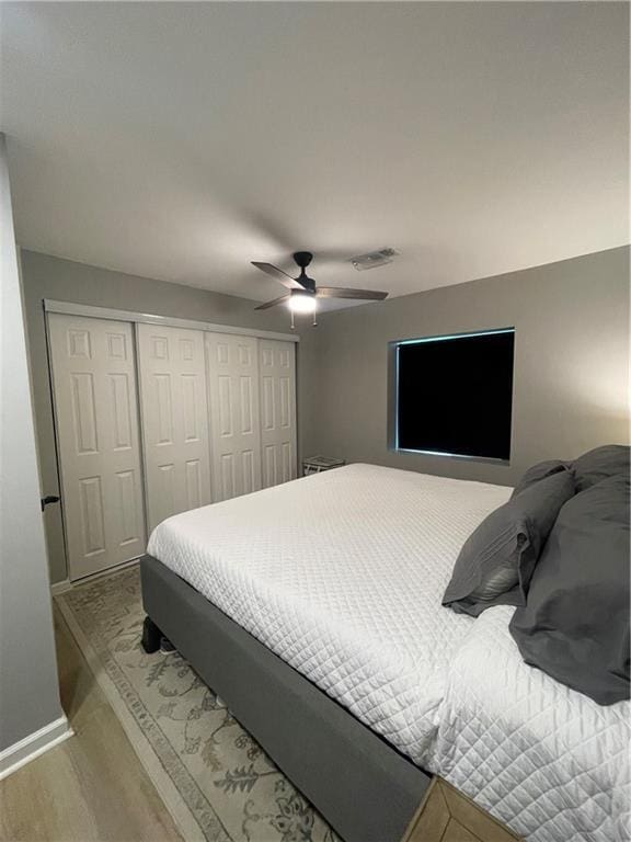 433 Spring Place Reseca Rd, Resaca, GA 30735 - bedroom with a closet, wood finished floors, ceiling fan, and baseboards