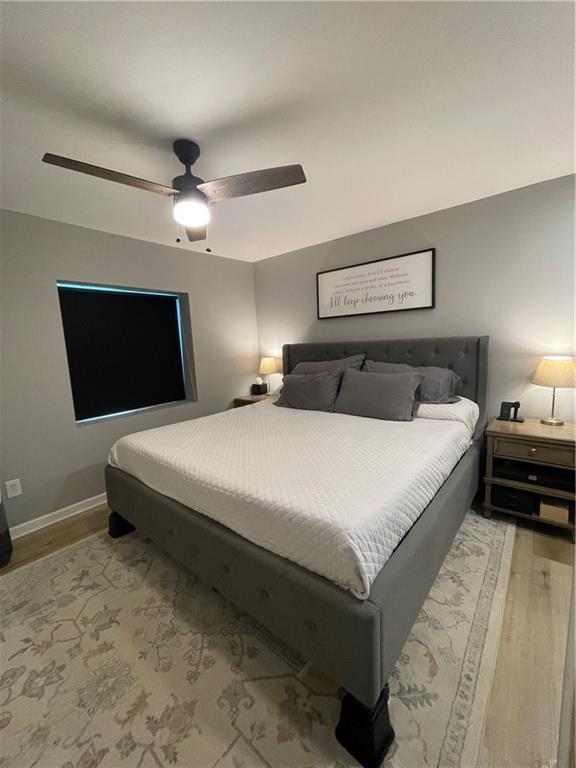 433 Spring Place Reseca Rd, Resaca, GA 30735 - bedroom featuring light wood finished floors, a ceiling fan, and baseboards