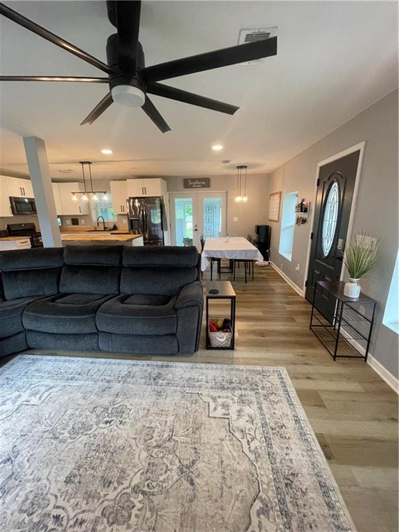 433 Spring Place Reseca Rd, Resaca, GA 30735 - living room with wood finished floors, baseboards, ceiling fan, and recessed lighting