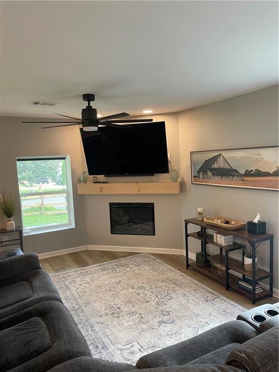433 Spring Place Reseca Rd, Resaca, GA 30735 - living area with a ceiling fan, wood finished floors, baseboards, a glass covered fireplace, and recessed lighting