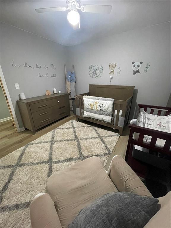 433 Spring Place Reseca Rd, Resaca, GA 30735 - bedroom with light wood-style floors and a ceiling fan