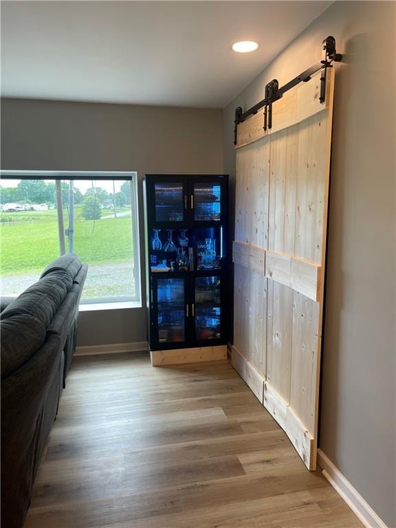 433 Spring Place Reseca Rd, Resaca, GA 30735 - living area with a barn door, wood finished floors, baseboards, and recessed lighting