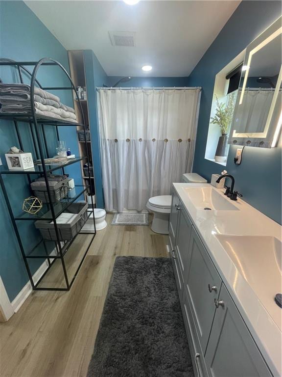 433 Spring Place Reseca Rd, Resaca, GA 30735 - full bath with toilet, wood finished floors, double vanity, and curtained shower