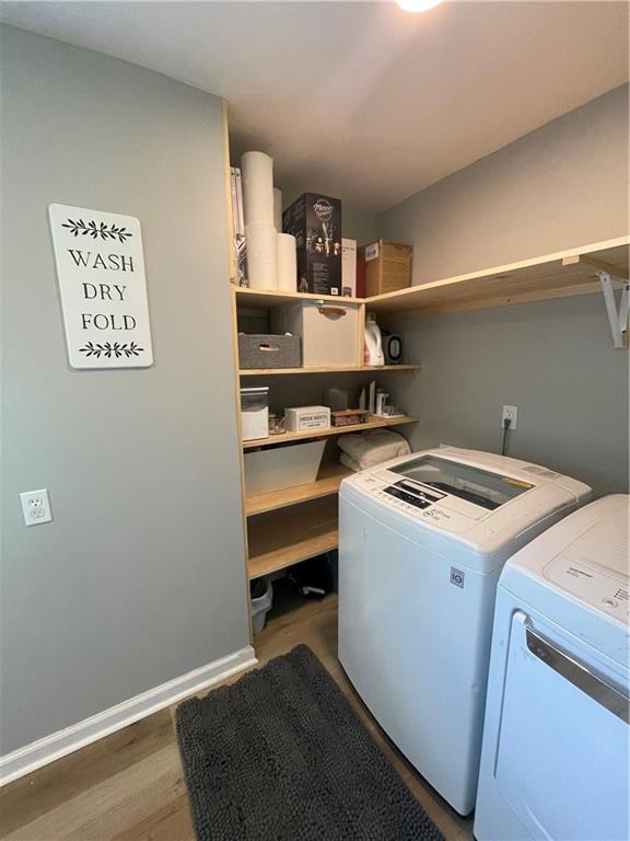 433 Spring Place Reseca Rd, Resaca, GA 30735 - washroom with washer and dryer and wood finished floors