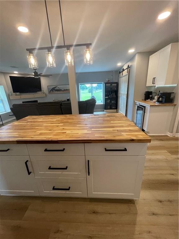 433 Spring Place Reseca Rd, Resaca, GA 30735 - kitchen featuring wood counters, beverage cooler, white cabinetry, healthy amount of natural light, and recessed lighting