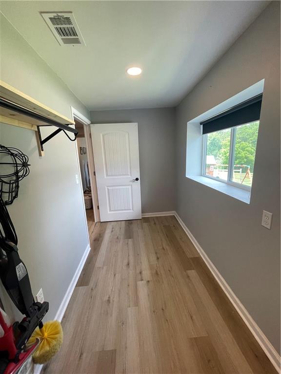 433 Spring Place Reseca Rd, Resaca, GA 30735 - corridor with light wood-style floors, baseboards, and recessed lighting