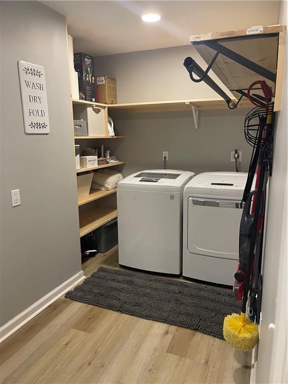 433 Spring Place Reseca Rd, Resaca, GA 30735 - laundry room featuring wood finished floors, washer and dryer, recessed lighting, and baseboards