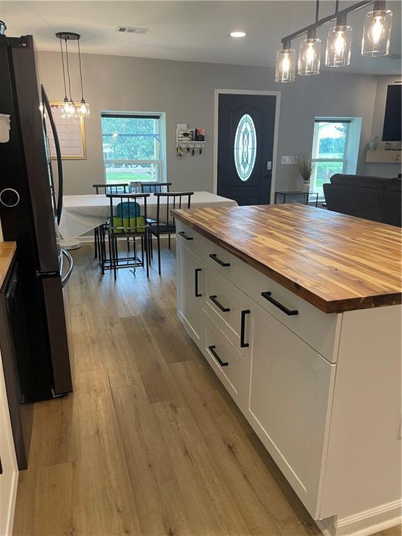 433 Spring Place Reseca Rd, Resaca, GA 30735 - kitchen featuring wood counters, freestanding refrigerator, plenty of natural light, and recessed lighting