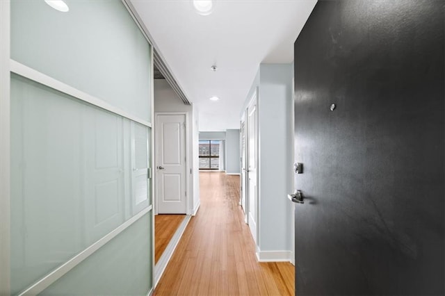 corridor featuring light wood-type flooring