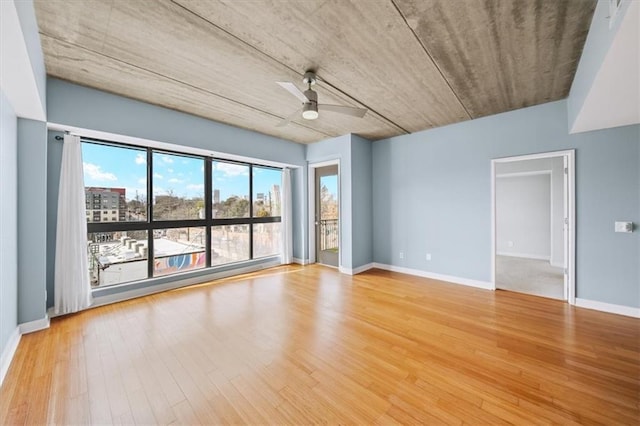 spare room with ceiling fan and light hardwood / wood-style floors