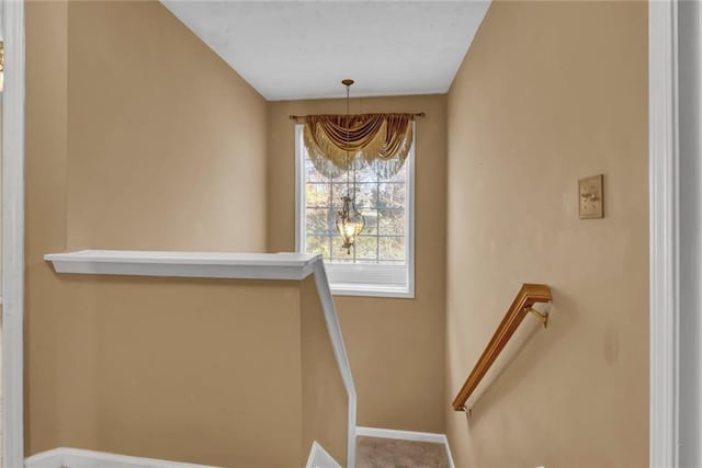 staircase featuring baseboards