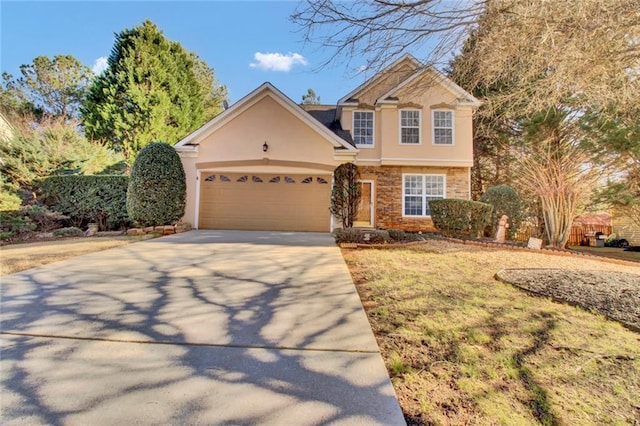 view of front of home featuring stone siding, stucco siding, concrete driveway, and a garage