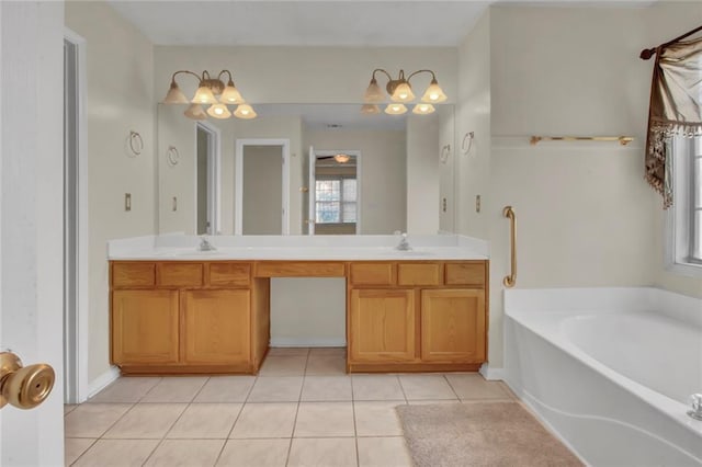 bathroom with a bath, tile patterned flooring, a sink, and double vanity