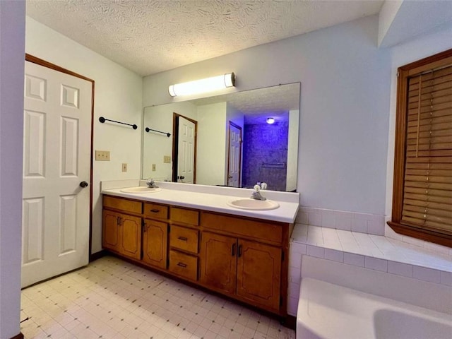 bathroom featuring vanity and a textured ceiling