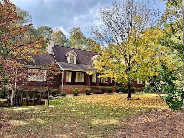 view of side of property with a lawn